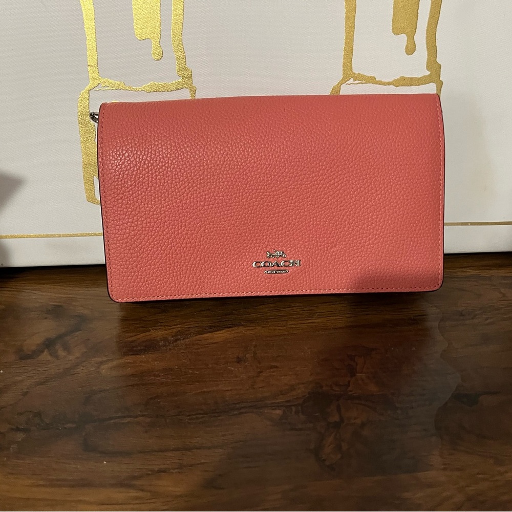 Coach Pink Leather Clutch with Minimalist Design